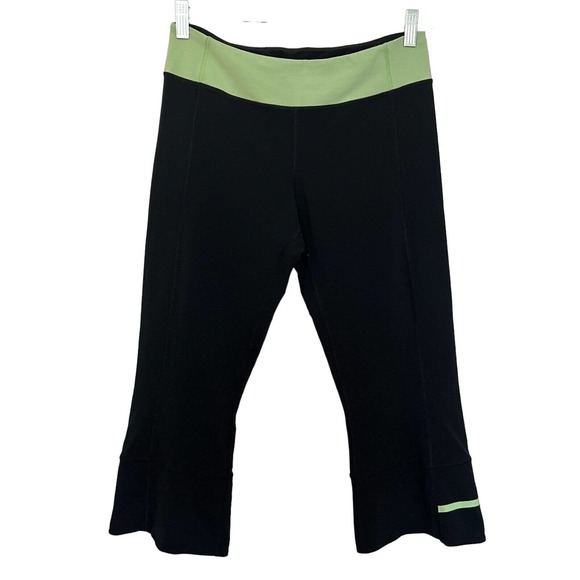 Lululemon Pants - Lululemon Gather & Crow Black with Green Waistband Cropped Bootcut Leggings - 8